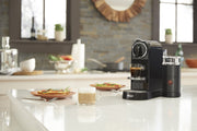 In use | Nespresso CitiZ and Aeroccino frother on a kitchen island with espresso and steamed milk