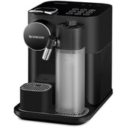 Angle | black single-serve espresso and coffee machine at a three-quarter angle with the milk-frothing jug attached and the drip tray raised