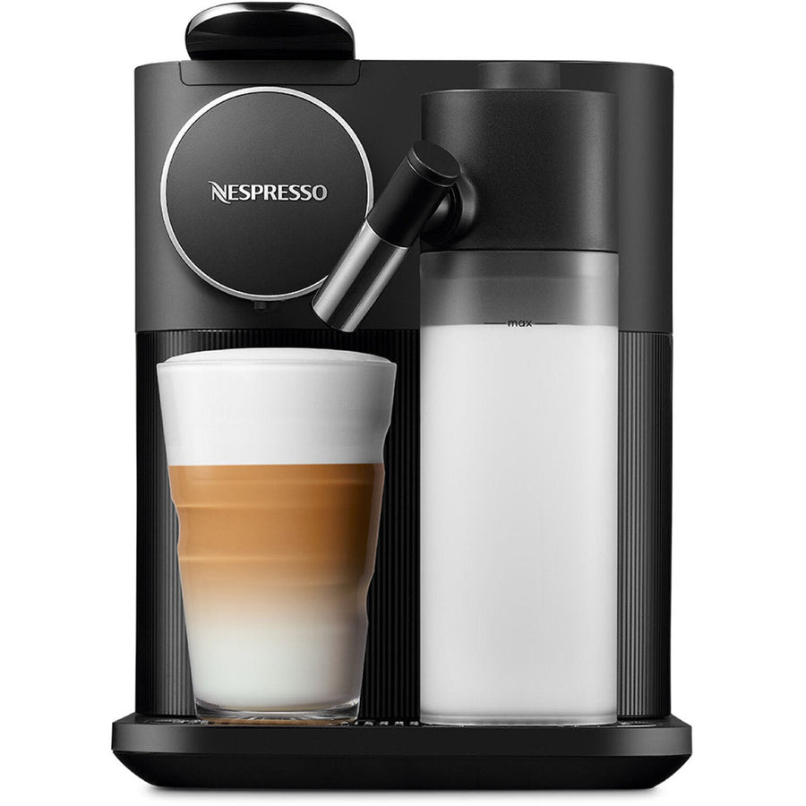 Front | black machine brewing a latte into a glass beside the built-in milk-frothing jug