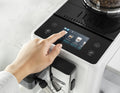 Detail | Touchscreen showing drink selection with a hand choosing a cappuccino