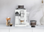 Lifestyle | White espresso machine on a countertop with an iced latte and a cappuccino brewing