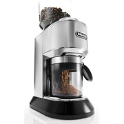 Angle | silver Dedica conical burr grinder with beans in the hopper grinding into the clear grounds container