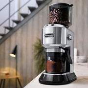 Side | silver conical burr grinder with the dosing dial and stainless body visible