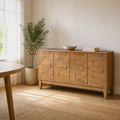 Second room | same sideboard in a warm white dining room with a leafy potted plant, morning window light on the faceted doors