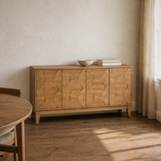 Third room | same sideboard in an ivory dining room with a smoked oak floor, warm afternoon window light on the faceted doors