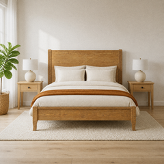 Room 2 | Straight-on bed in a bright room with a window, plant, lamps, and pale rug