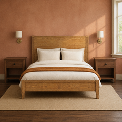 Room 3 | Straight-on bed against a clay wall with brass sconces, warm wood, and a rug