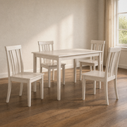 Second room | the same table and four chairs in a warm plaster dining room, window at right