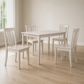 Third room | the same table and four chairs in a bright flax dining room, midday light