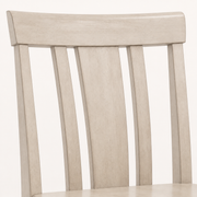 Texture | close-up on the slat-back joinery and antique white wood grain