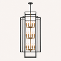 Front | studio front elevation of the black nested iron cage, gold pole, and three tiers of candle lights