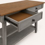 Detail | one drawer pulled open showing the slide and dark-bronze knob