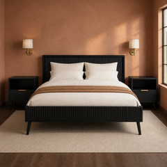 Room 3 | Clay room corner view of the black fluted bed, nightstand, rug, and window