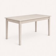 Studio angle | three-quarter studio view of the tabletop's chamfered edge, apron, and tapered legs