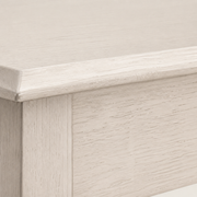 Texture | close-up on the antique-white finish and rubberwood grain along the tabletop's edge