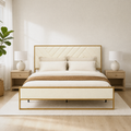 Airy room | Bright bedroom view of the bed with light wood nightstands, lamps, and an open underbed gap