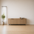 In a room | coastal oak reeded 4-door sideboard centered on a warm white dining wall, window and potted plant at left, a ceramic bowl and books on top