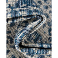 Folded corner | one corner turned back to show the weave and backing