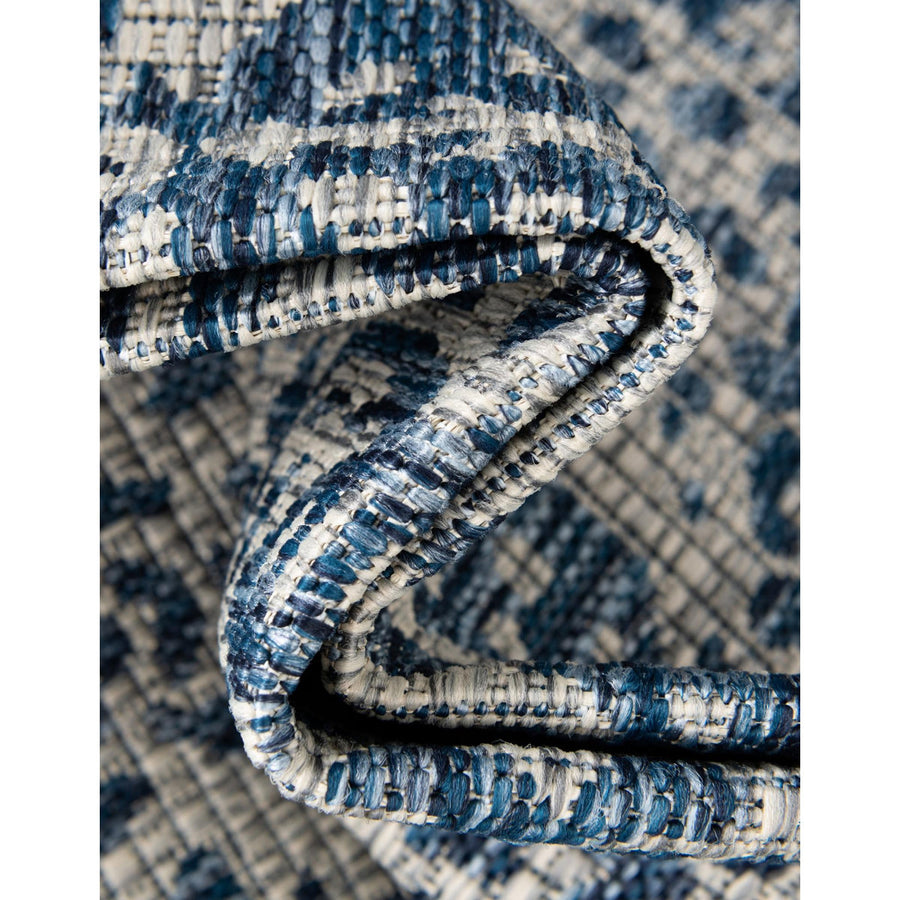 Folded corner | one corner turned back to show the weave and backing