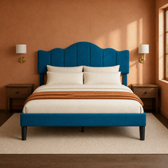 Room 3 | Warm clay bedroom view of the blue scalloped headboard with dark nightstands and wall lamps