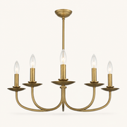 Front | studio front of the five curved brass arms and candle-style bulbs
