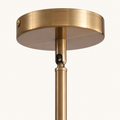 Hardware | close-up of the Marnau Glazenn chandelier's brass ceiling canopy and downrod, showing the swivel coupling used for sloped-ceiling installs