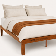 Detail | Close view of the warm wood grain on the front rail and square corner leg