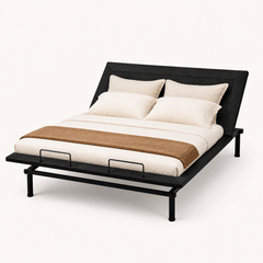 Studio angle | Three-quarter studio view showing the upholstered surface, raised head section, foot handles, and legs