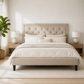 Blue room | Light beige tufted platform bed in a blue-gray city bedroom