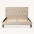 Front | Straight-on studio view of the light beige framed and button-tufted bed