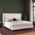 Forest-green bedroom | Textured ivory canvas wingback bed with preserved bedding and a burgundy rug