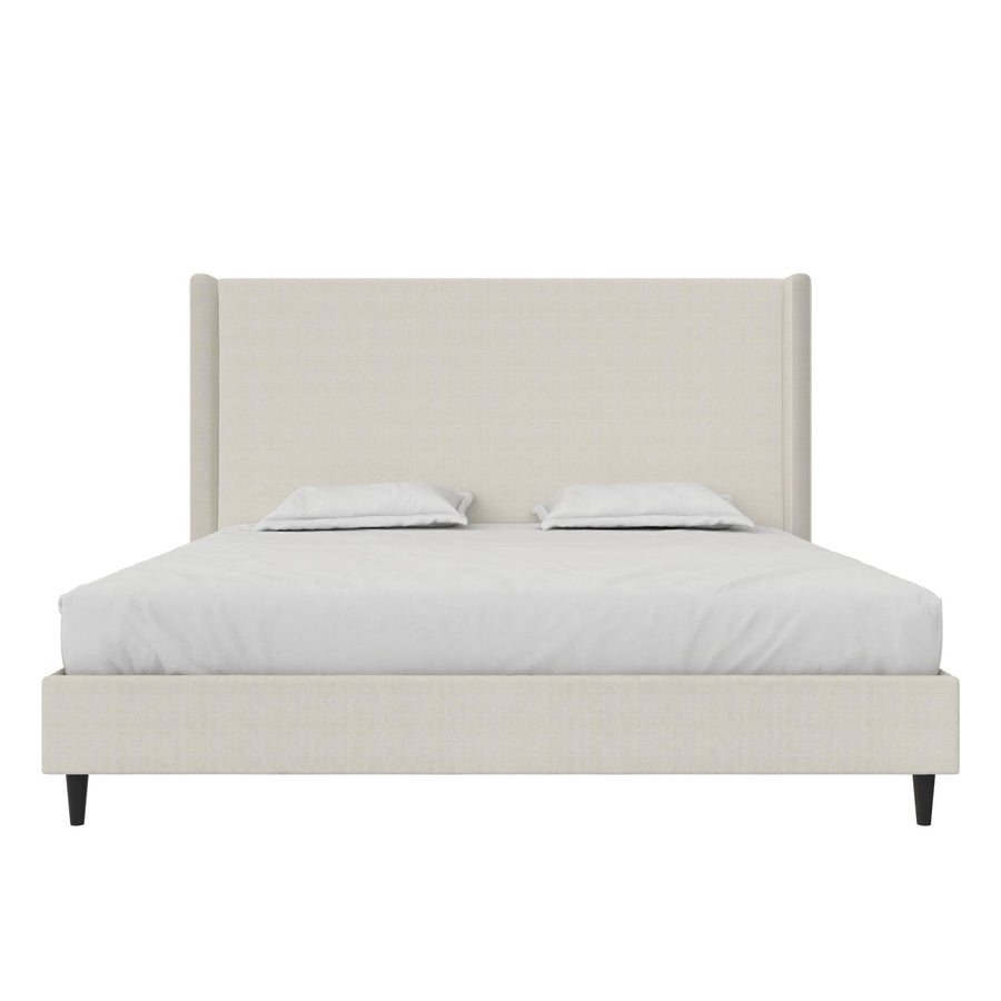 Studio front | Textured ivory canvas wingback bed with bedding, straight headboard and black tapered legs