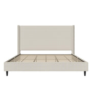 Studio frame front | Textured ivory canvas wingback bed showing the footboard, slats and two black legs