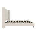 Studio side | Textured ivory canvas wingback bed frame in profile with slats and tapered foot leg