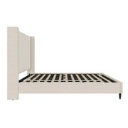 Studio side | Textured ivory canvas wingback bed frame in profile with slats and tapered foot leg
