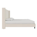 Studio side with bedding | Textured ivory canvas wingback bed showing rail height and wing depth