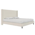 Studio angle with bedding | Textured ivory canvas wingback bed from the front right