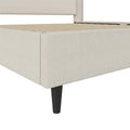 Canvas and leg detail | Close view of the flat woven footboard upholstery, corner seam and black tapered leg