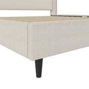 Canvas and leg detail | Close view of the flat woven footboard upholstery, corner seam and black tapered leg
