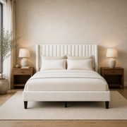 Warm ivory bedroom | Ivory linen-blend wingback bed with walnut nightstands