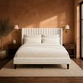 Terracotta bedroom | Ivory channel-tufted wingback bed with walnut nightstands