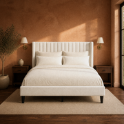 Terracotta bedroom | Ivory channel-tufted wingback bed with walnut nightstands
