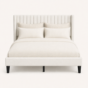 Studio front | Ivory linen-blend bed with tall channel-tufted wingback headboard