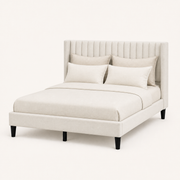 Studio angle | Front-right view of Ivory upholstered wingback bed and black tapered legs