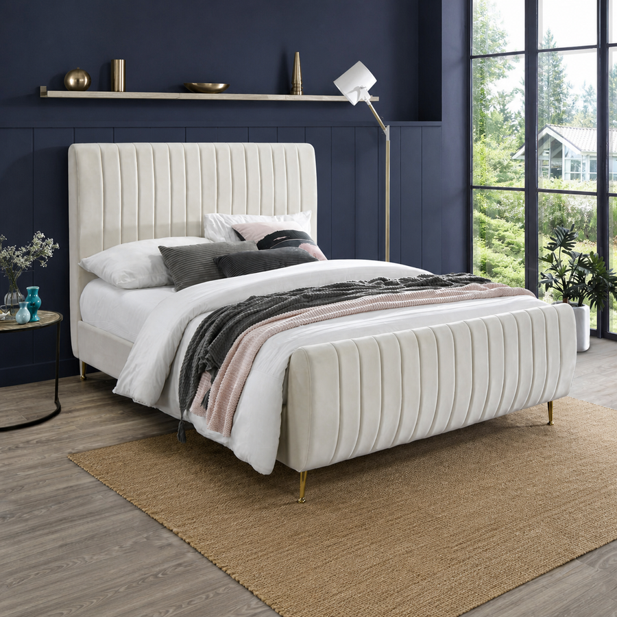 Midnight blue bedroom | Cream velvet channel-tufted bed with white bedding and gold legs