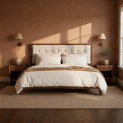 Terracotta bedroom | Walnut and light linen platform bed with brass sconces
