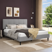 Aubergine bedroom | Light Gray low profile platform bed with a five-channel headboard, patterned bedding, bronze window panels, and a cream geometric rug