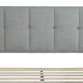 Headboard and slats | Light Gray vertical-channel headboard above the exposed wood slat system