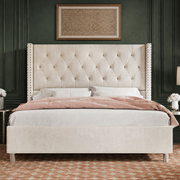 Forest green bedroom | Straight-on view of the Cream tufted wingback bed with a rust geometric rug and framed textile