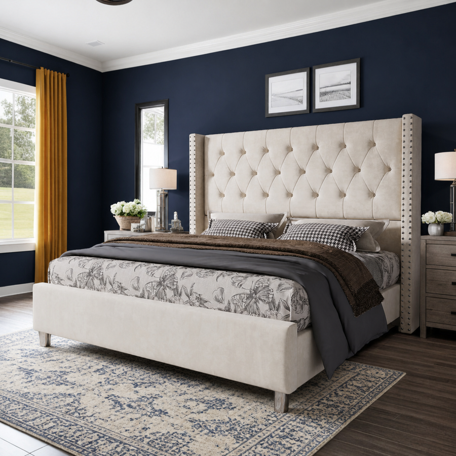 Midnight indigo bedroom | Three-quarter view of the Cream tufted wingback bed with ochre curtains and an ivory-and-indigo rug